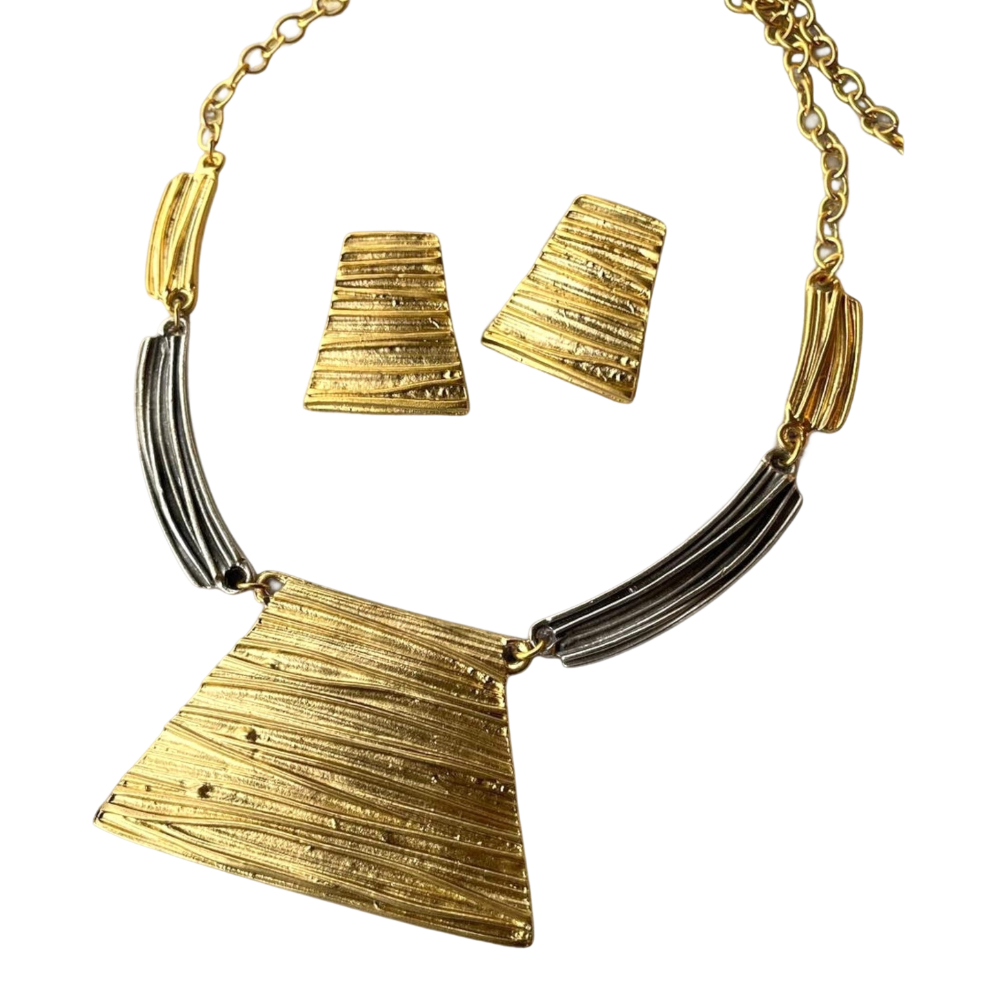 a gold and silver necklace and matching earrings