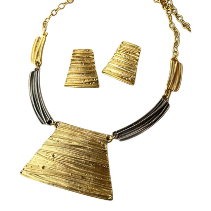 a gold and silver necklace and matching earrings