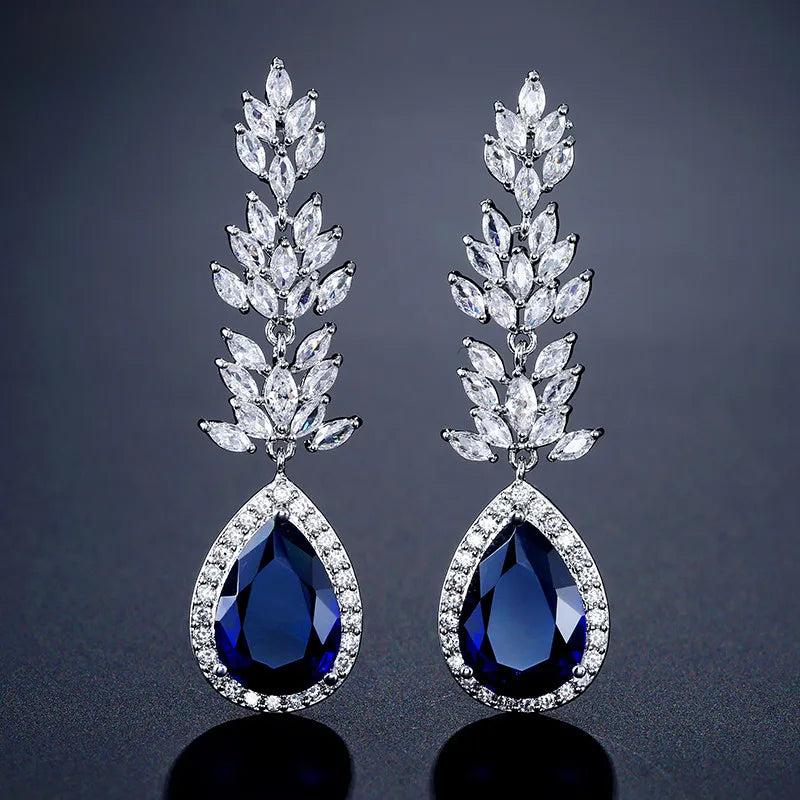 a pair of blue and white crystal earrings