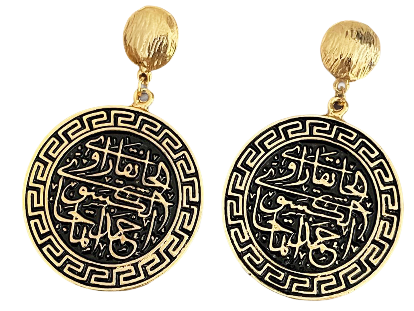 a pair of gold and black earrings with arabic writing