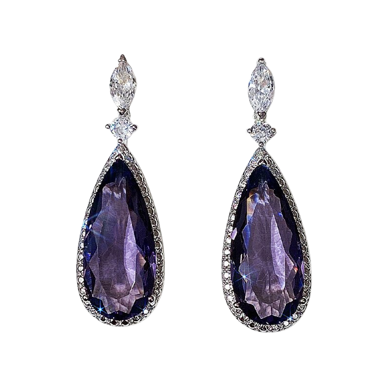 a pair of earrings with purple stones and diamonds