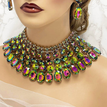 a close up of a woman wearing a necklace and earrings