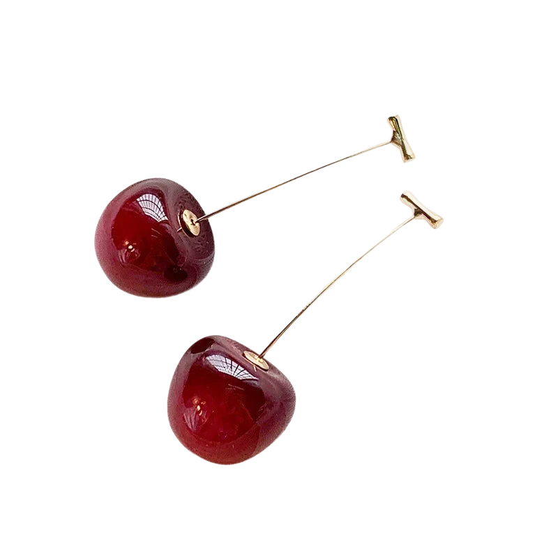 a pair of cherries on a black background