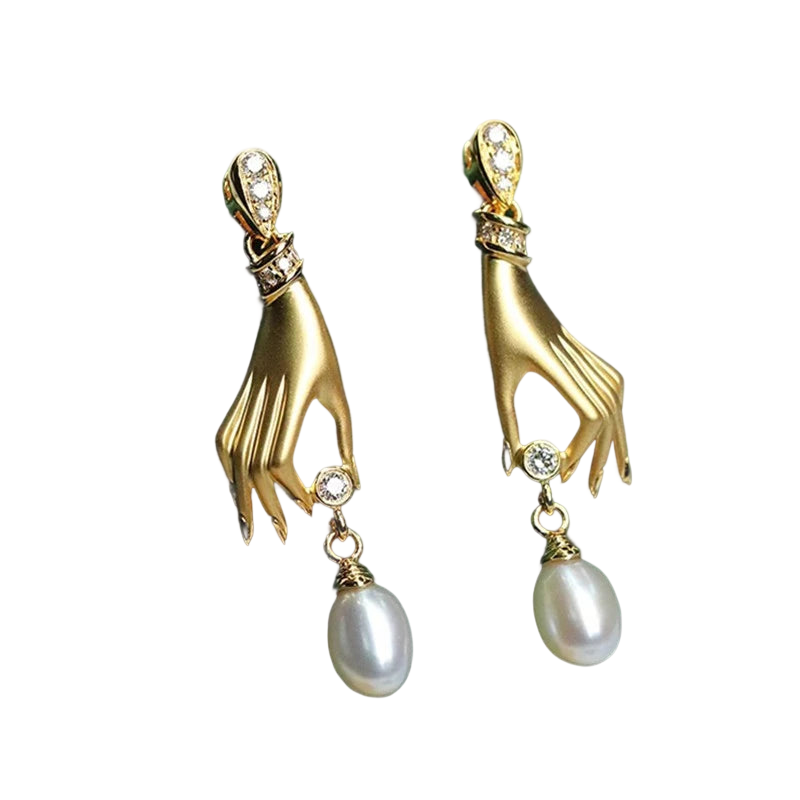 a pair of gold and pearl earrings