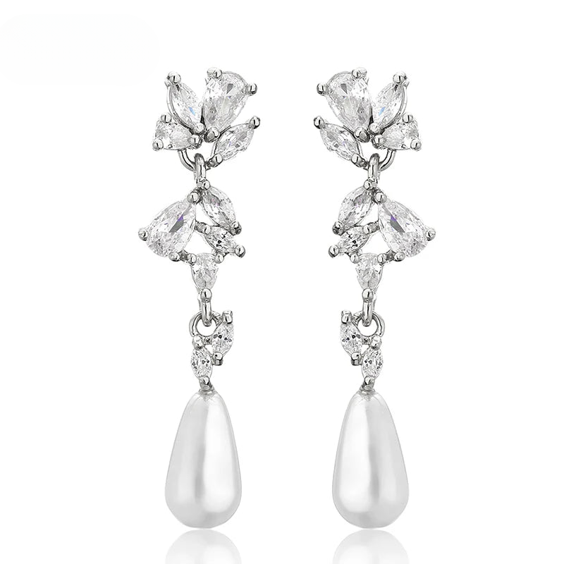 a pair of white pearl and crystal earrings