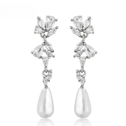 a pair of white pearl and crystal earrings