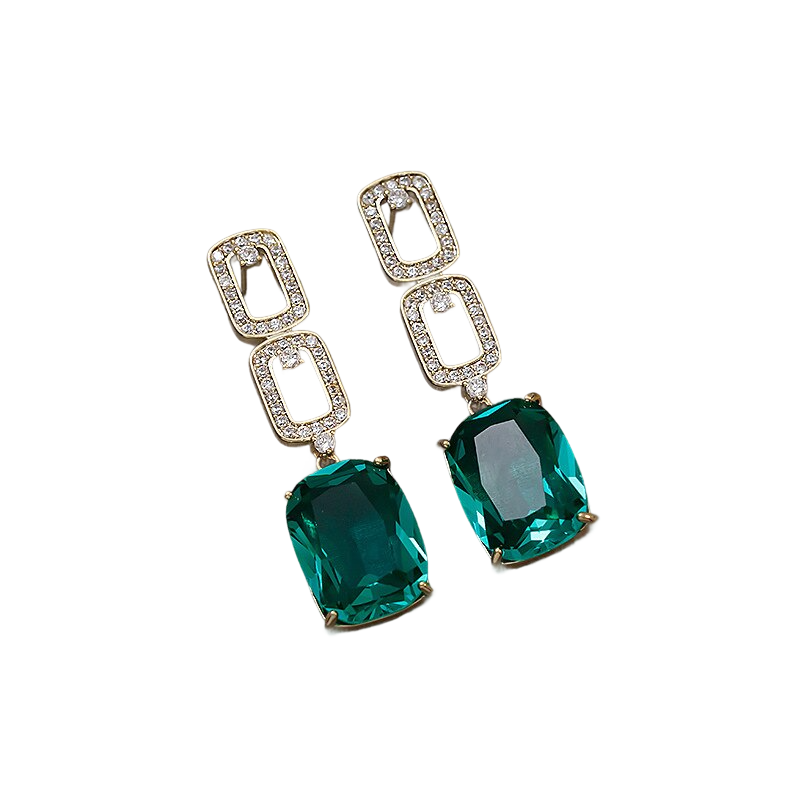 a pair of emerald and diamond earrings