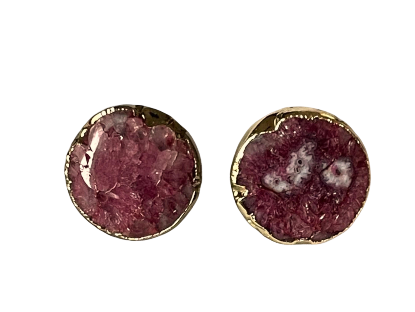 a pair of earrings with a pink stone in the middle