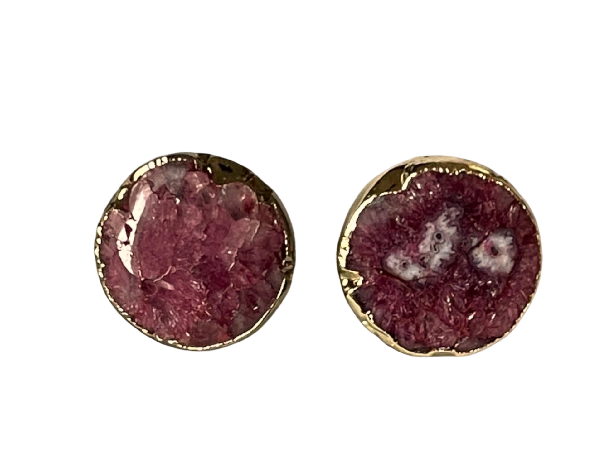 a pair of earrings with a pink stone in the middle