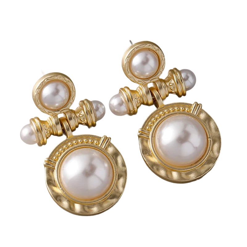 a pair of gold and pearl earrings