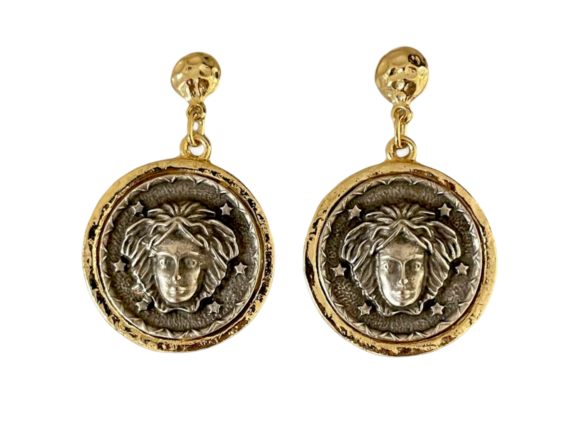 a pair of earrings with a lion head on it