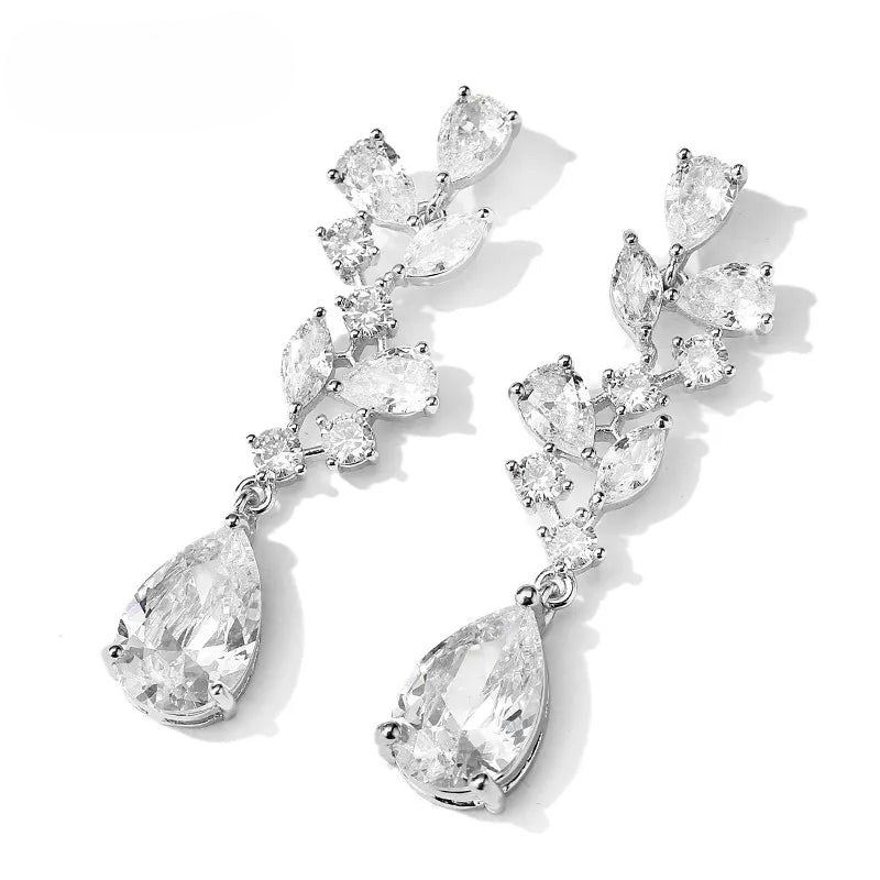 a pair of earrings on a white background