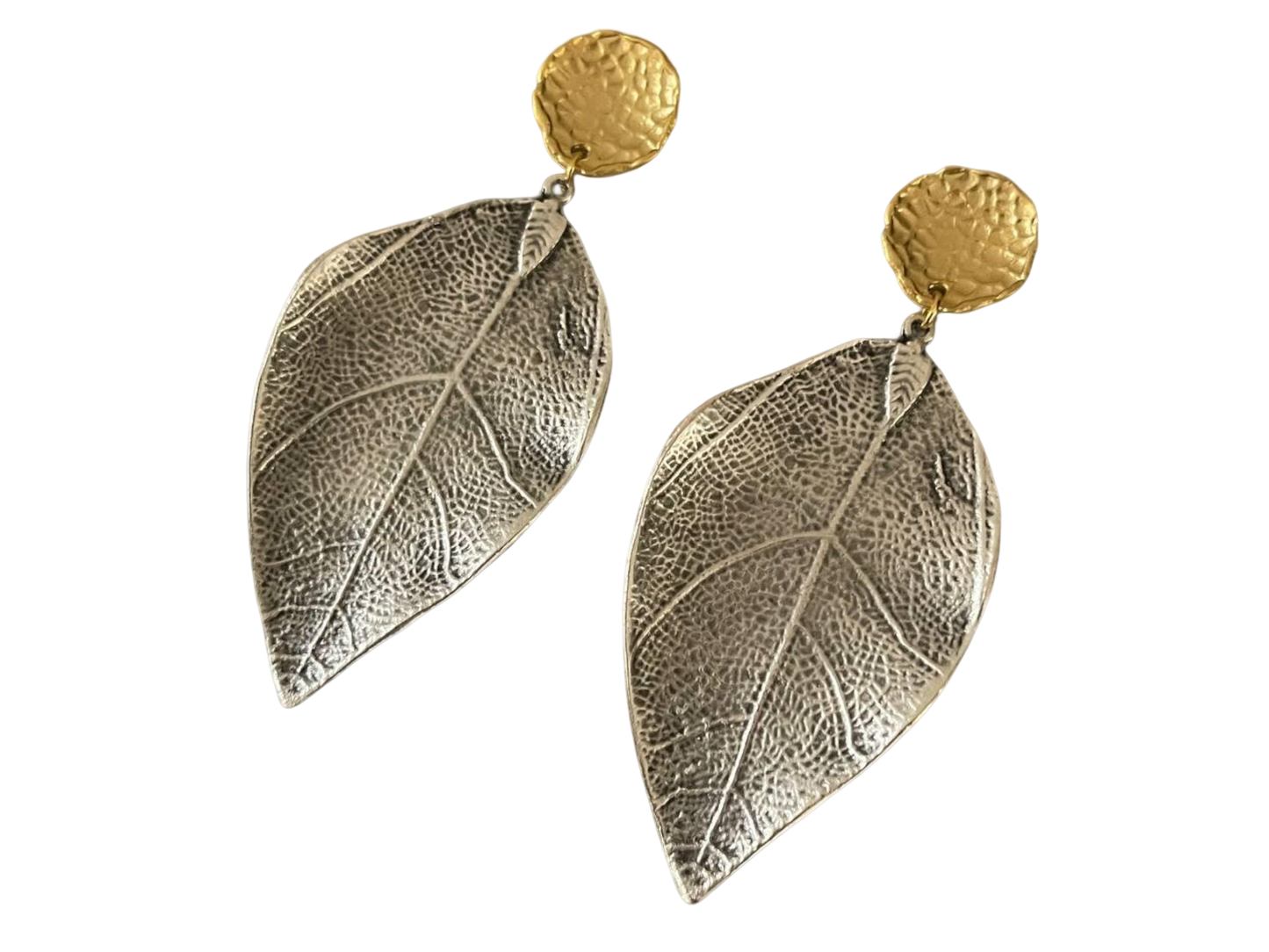 a pair of silver and gold leaf earrings