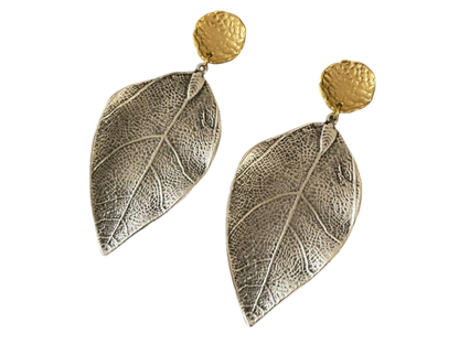 a pair of silver and gold leaf earrings