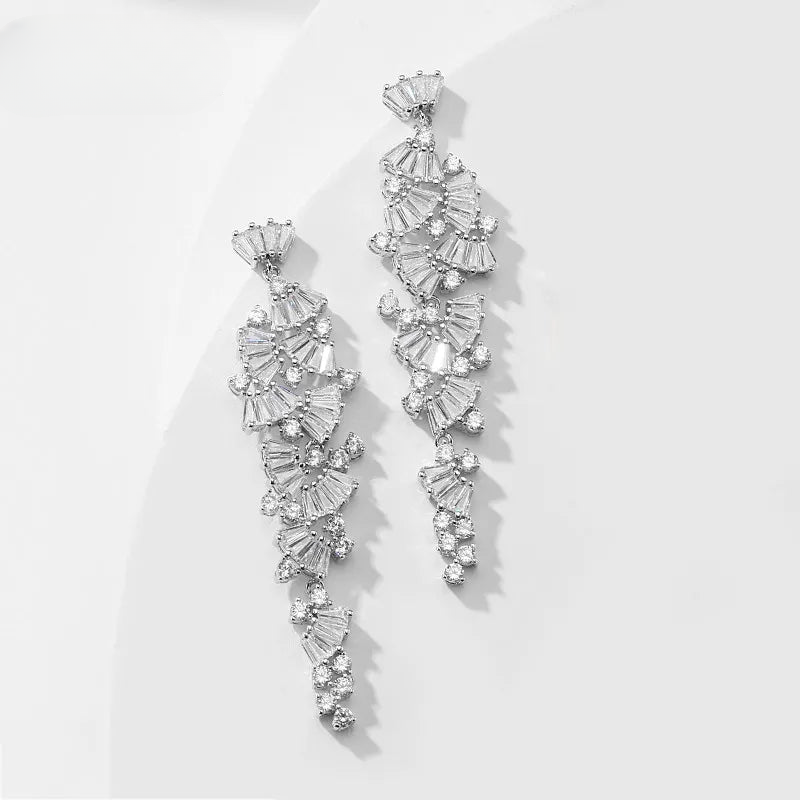 a pair of earrings on a white surface