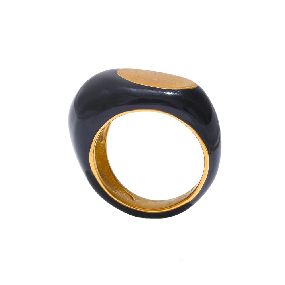 a black and gold ring on a black background