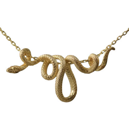 a gold snake necklace on a black background