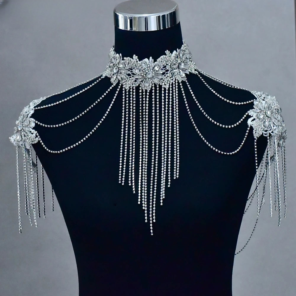 a black mannequin with silver chains and beads