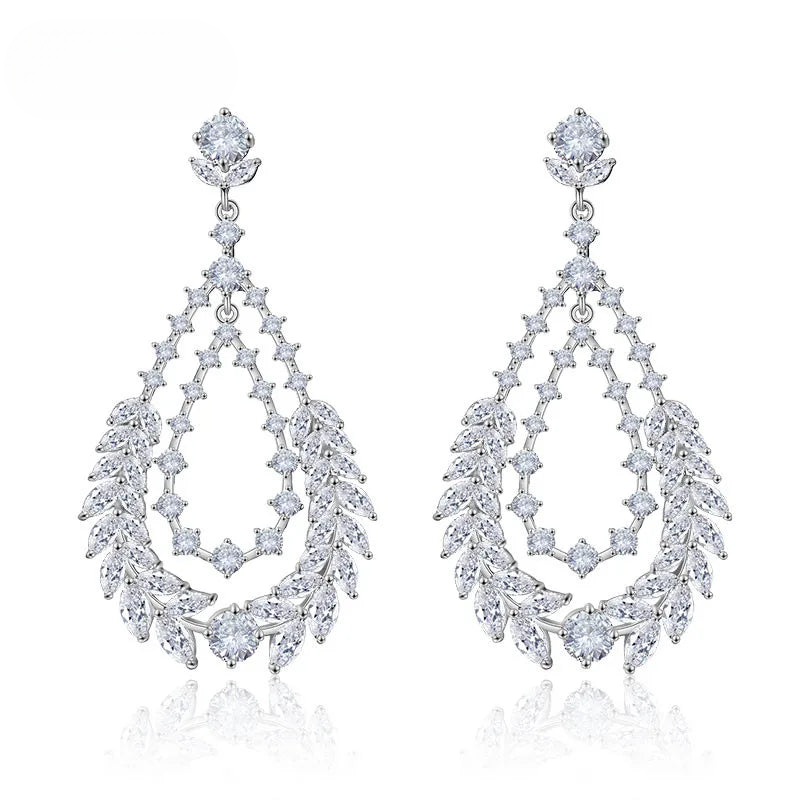 a pair of white gold and diamond earrings