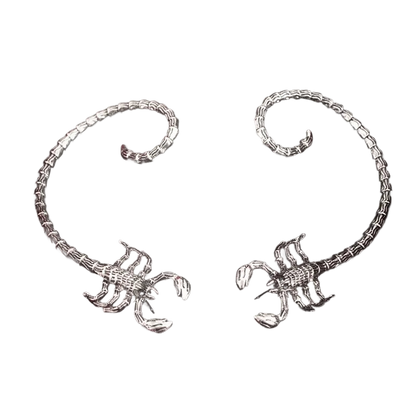 a pair of silver bracelets on a black background