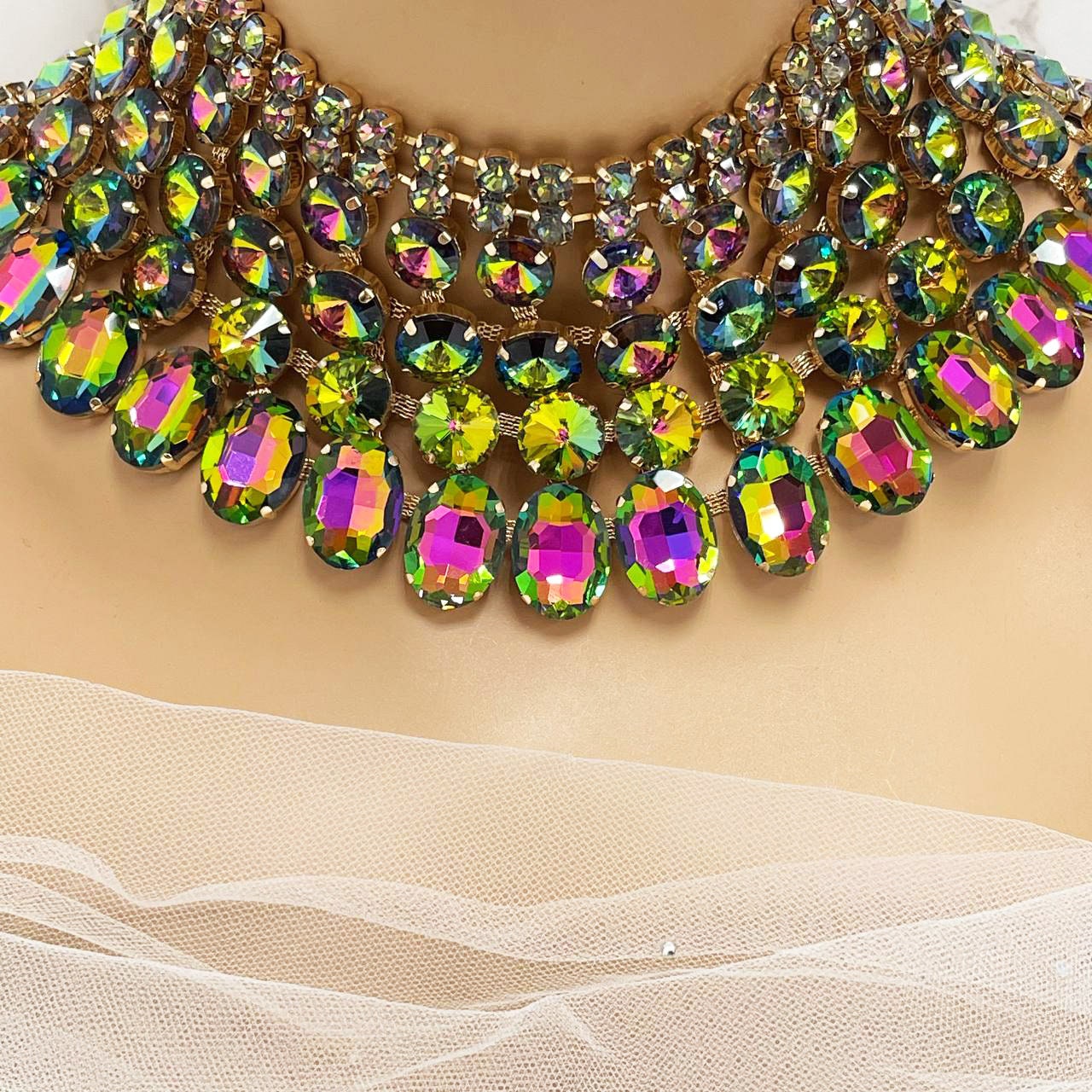 a woman wearing a multicolored necklace on her neck