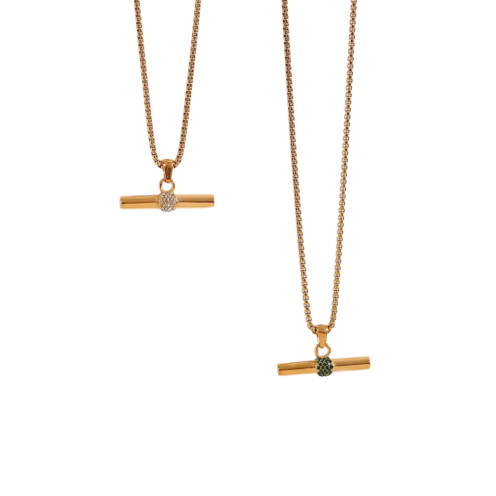 two gold necklaces with a green and white diamond