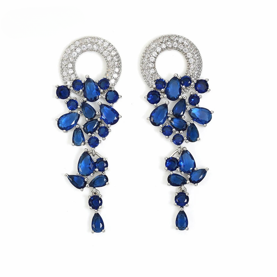 a pair of blue and white crystal earrings