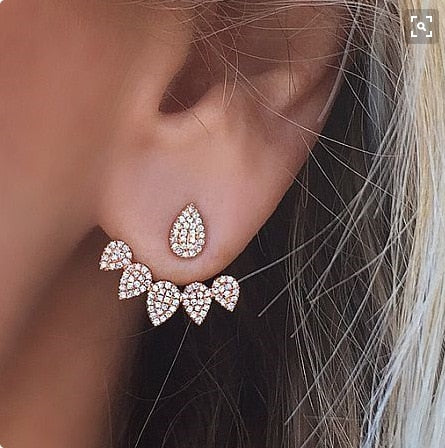 Elegant Crystal Flower Stud Earrings
 
 Add a touch of elegance to your outfit with these trendy crystal flower stud earrings. The irregular shape and intricate design make them a perfect accessory forGlam DuchessGlam DuchessElegant Crystal Flower Stud Earrings