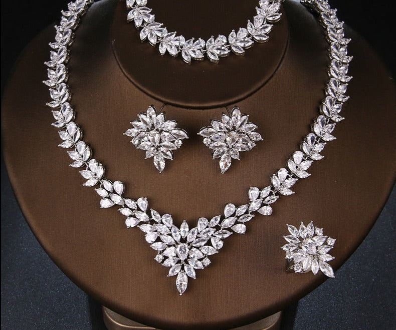 Elegant Plant-Inspired Bridal Jewelry Set
 
 Elevate your style with this trendy and elegant jewelry set featuring stunning cubic zirconia stones in a beautiful white color. The set includes a necklace and Glam DuchessGlam DuchessElegant Plant-Inspired Bridal Jewelry Set