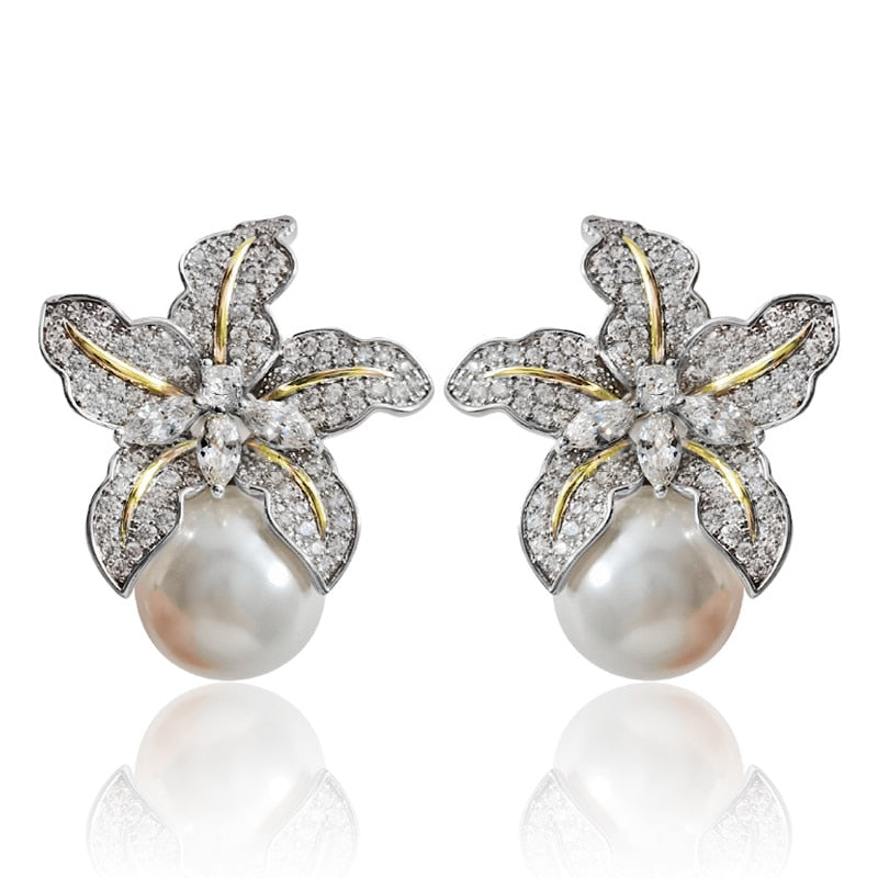 Floral Pearl Stud Earrings
 
 Enhance your style with these trendy Flower Pearl Stud Earrings. The geometric shape and simulated-pearl design add a touch of elegance to any outfit.
 
 
MateriGlam DuchessGlam DuchessFloral Pearl Stud Earrings