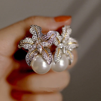 Floral Pearl Stud Earrings
 
 Enhance your style with these trendy Flower Pearl Stud Earrings. The geometric shape and simulated-pearl design add a touch of elegance to any outfit.
 
 
MateriGlam DuchessGlam DuchessFloral Pearl Stud Earrings