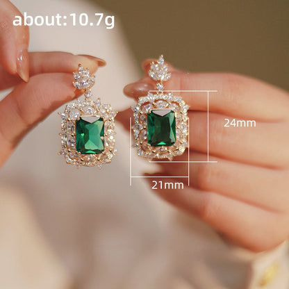 Radiant Green Emerald Geometric Drop Earrings
 
 Discover the elegance and trendiness of our Green Emerald Cubic Zirconia Earrings. Crafted from high-quality copper alloy and adorned with radiant cubic zirconiaGlam DuchessGlam DuchessRadiant Green Emerald Geometric Drop Earrings