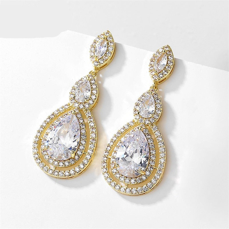 Waterdrop Cubic Zirconia Bridal Earrings
 
 Add a touch of elegance to your bridal ensemble with our Waterdrop Cubic Zirconia Bridal Earrings. These exquisite earrings feature:
 
 
Style: TRENDY
 
Stone FoGlam DuchessGlam DuchessWaterdrop Cubic Zirconia Bridal Earrings