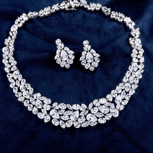 Exquisite Cubic Zirconia Wedding Jewelry Set

 Elegant Cubic Zirconia Bridal Necklace Earrings Set
 Get ready to dazzle on your special day with this exquisite Cubic Zirconia bridal necklace and earrings set. Glam DuchessGlam DuchessExquisite Cubic Zirconia Wedding Jewelry Set