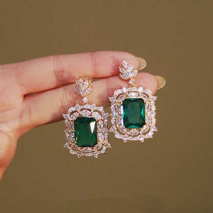 Radiant Green Emerald Geometric Drop Earrings
 
 Discover the elegance and trendiness of our Green Emerald Cubic Zirconia Earrings. Crafted from high-quality copper alloy and adorned with radiant cubic zirconiaGlam DuchessGlam DuchessRadiant Green Emerald Geometric Drop Earrings