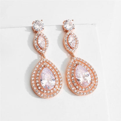 Waterdrop Cubic Zirconia Bridal Earrings
 
 Add a touch of elegance to your bridal ensemble with our Waterdrop Cubic Zirconia Bridal Earrings. These exquisite earrings feature:
 
 
Style: TRENDY
 
Stone FoGlam DuchessGlam DuchessWaterdrop Cubic Zirconia Bridal Earrings