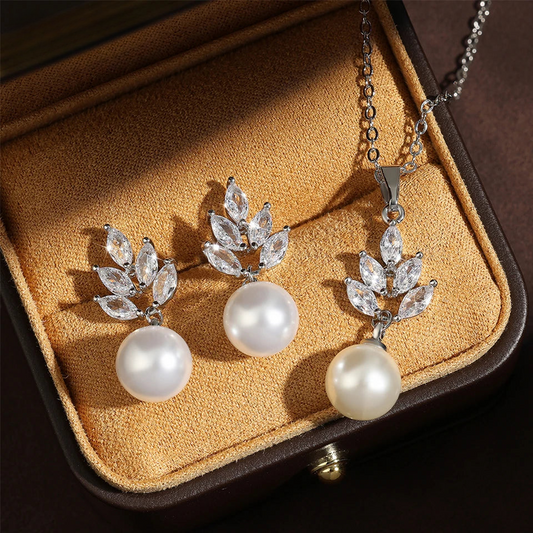 three pieces of jewelry in a case