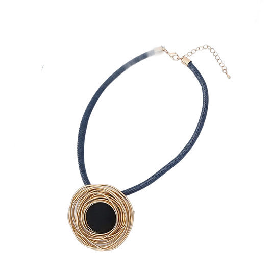 a black and gold necklace with a black circle on it