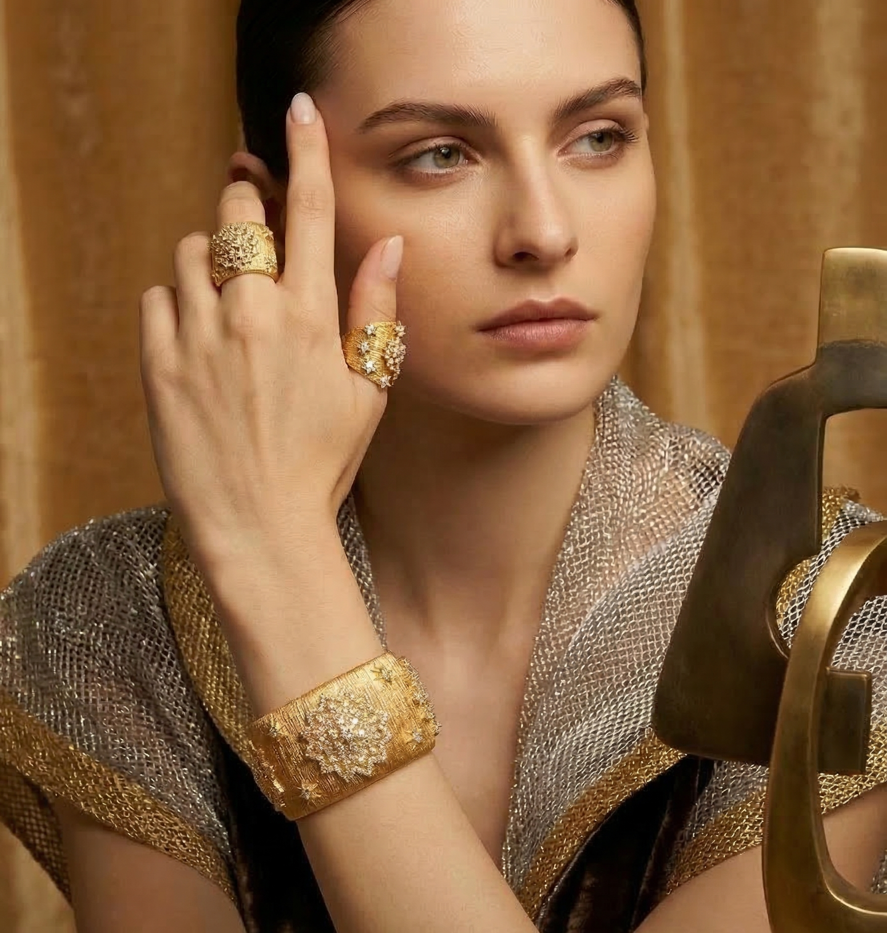 Woman wearing 18k gold plated cubic zirconia cluster bracelet and ring set, Silver & Sun collection