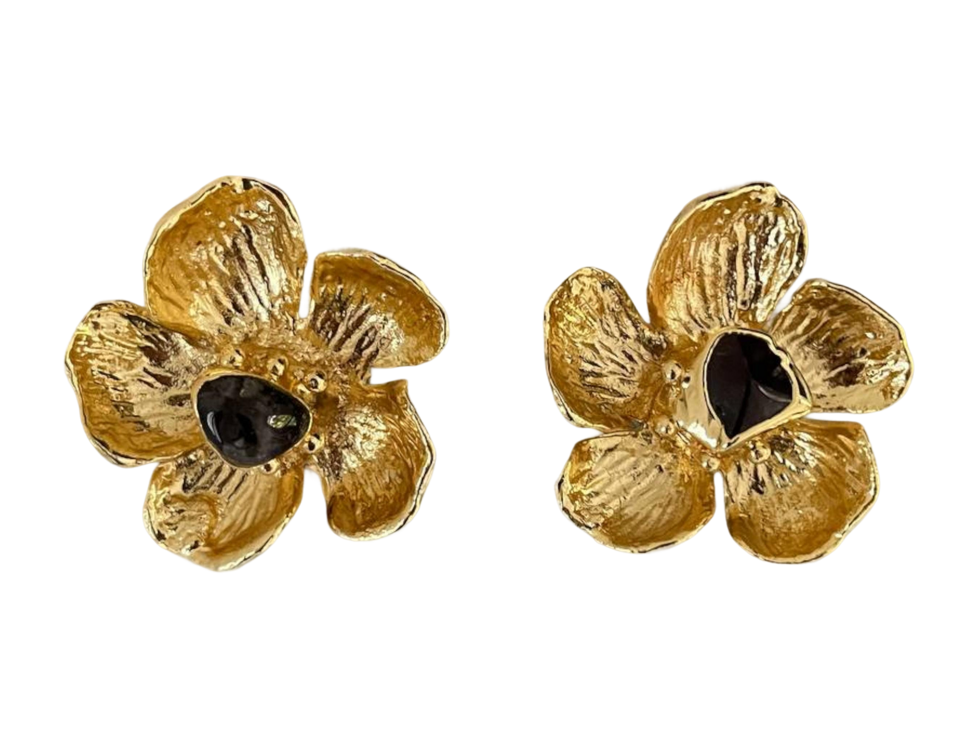 a pair of gold flower earrings with black stones