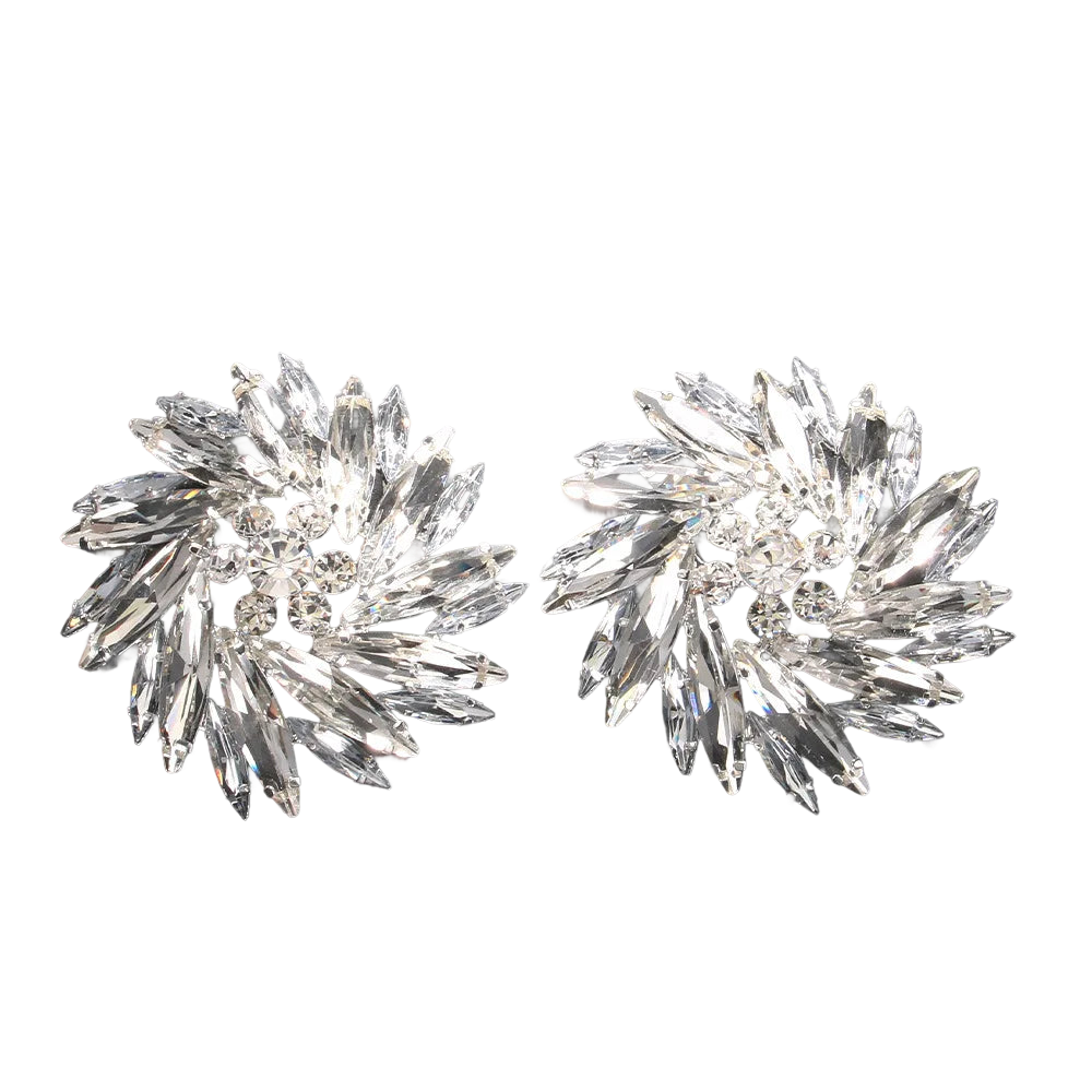 a pair of crystal earrings on a black background