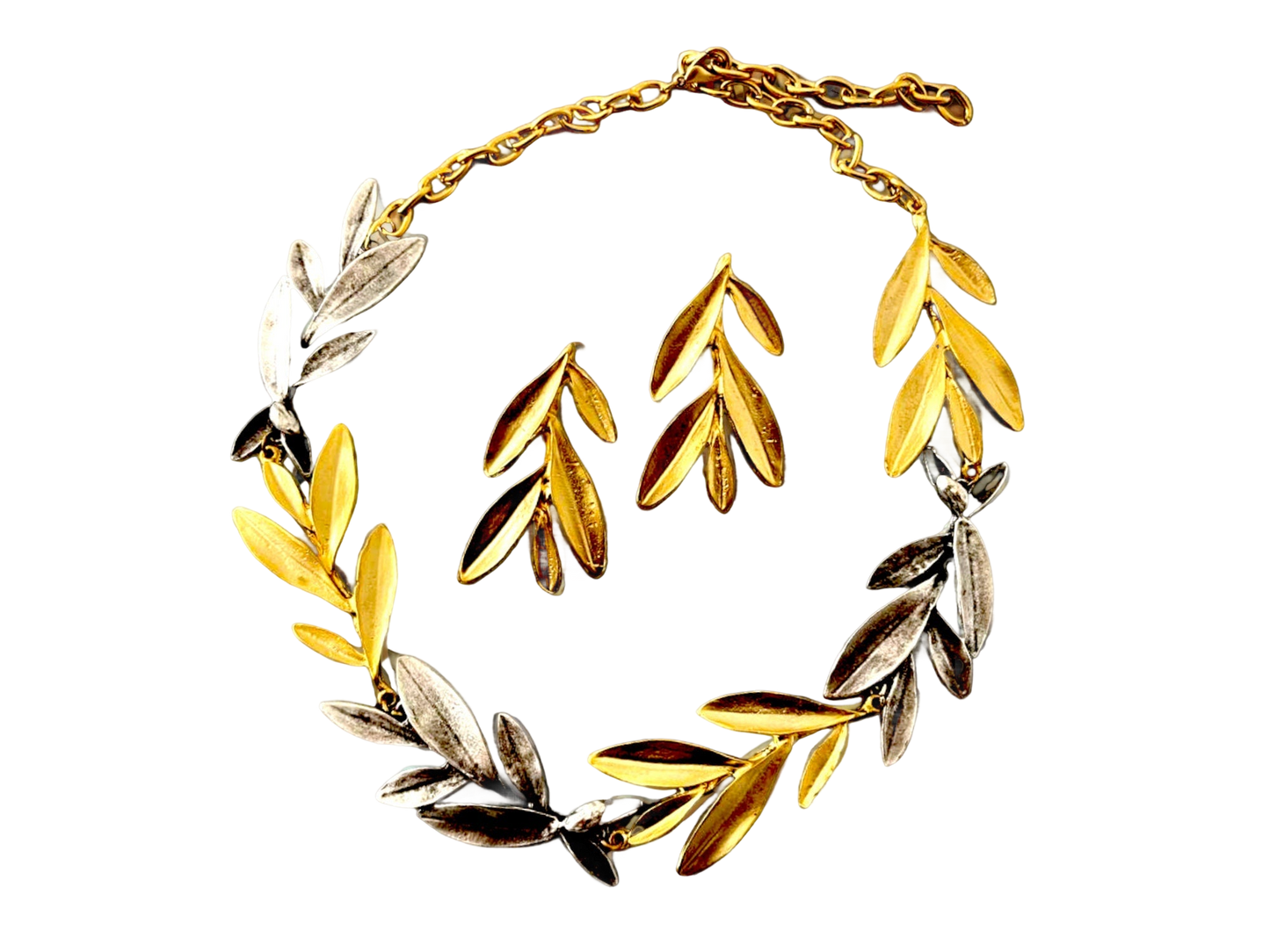 a gold and silver bracelet with leaves on it