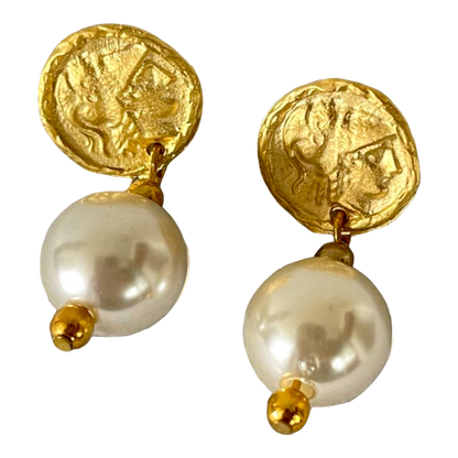 a pair of gold and pearl earrings