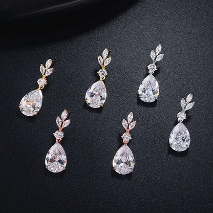 a set of four different styles of earrings