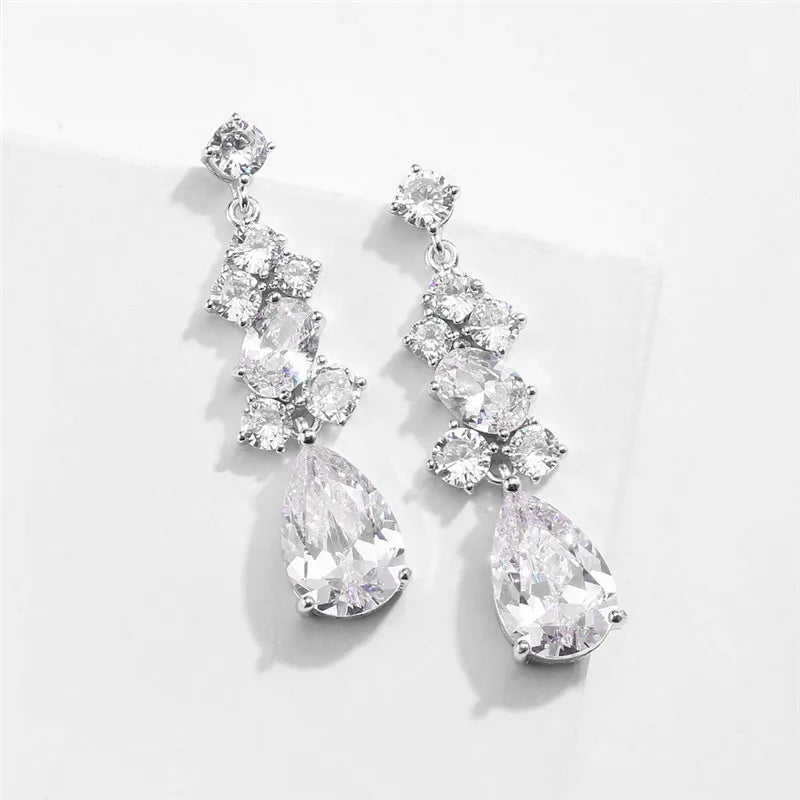 a pair of earrings on a white surface