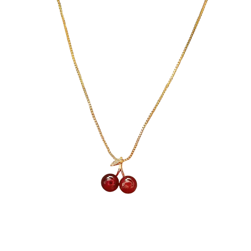 a necklace with two cherries hanging from it