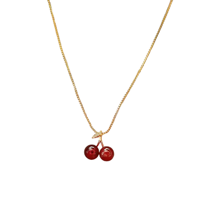 a necklace with two cherries hanging from it