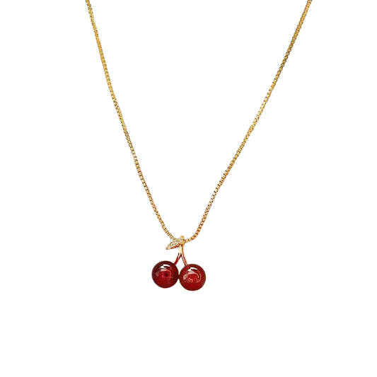 a necklace with two cherries hanging from it