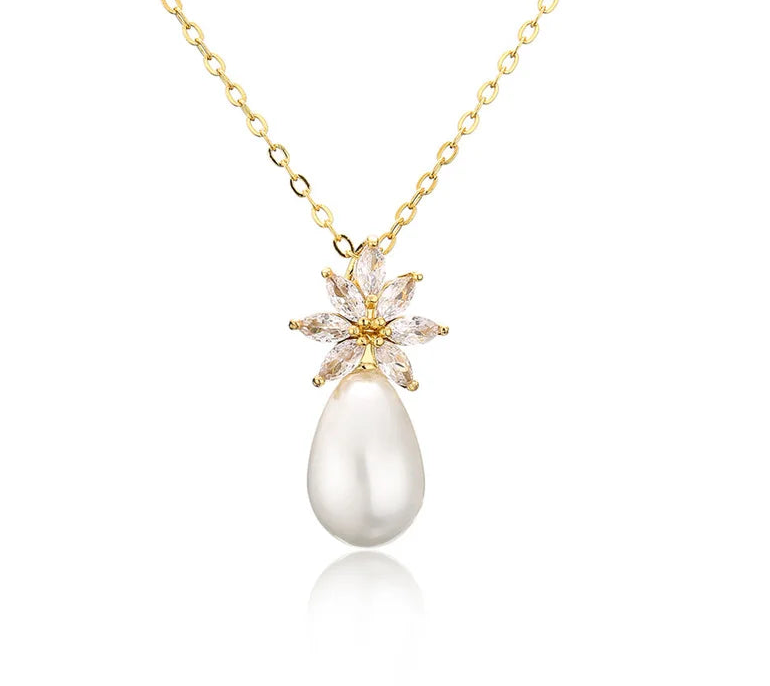 a necklace with a flower and a pearl