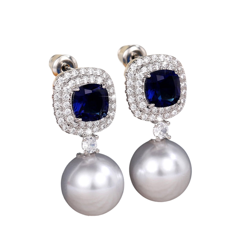 a pair of blue and white pearls and diamond earrings